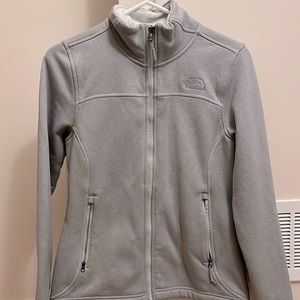 Gray zip up, fleece lined North Face jacket